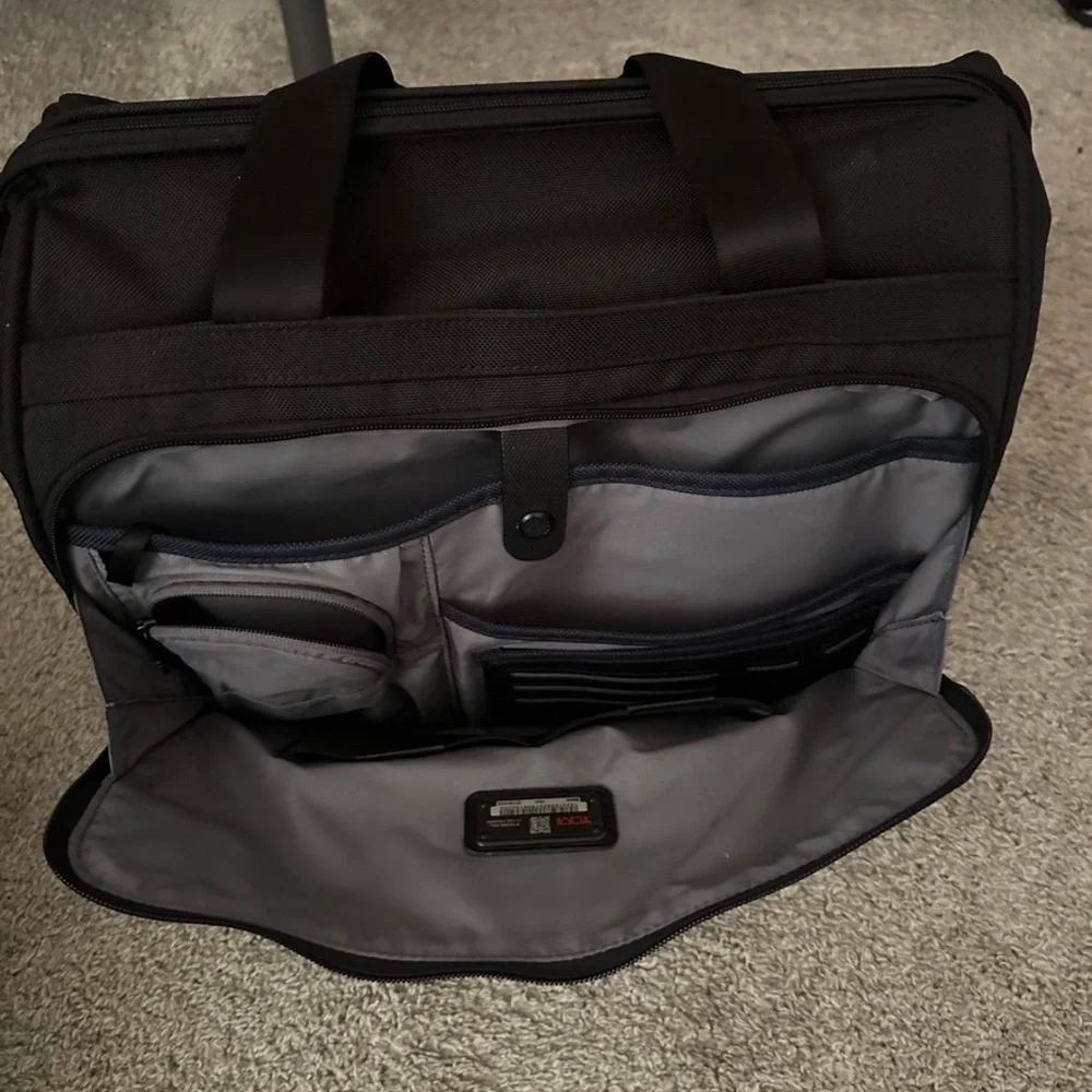 Tumi carry-on bag.